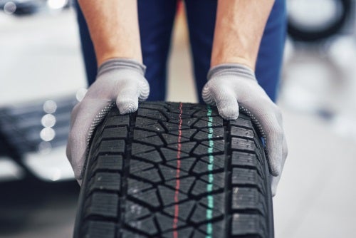 Kia Service Technician and New Tire